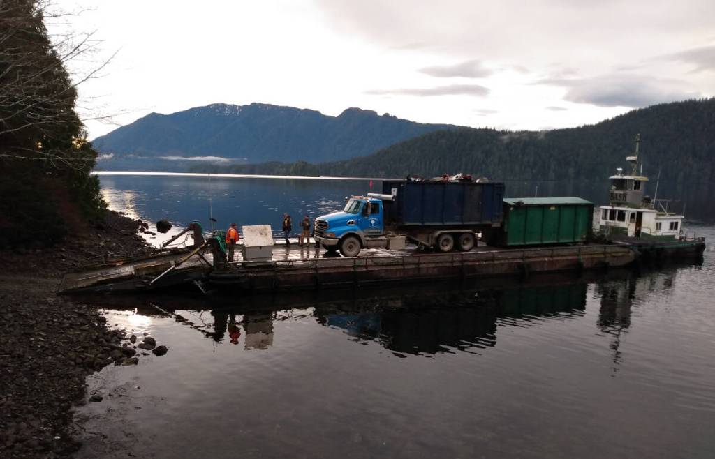 Fox Disposal hauling out a bin of scrap metal and garbage using the existing private ramp in Quatsino. (Gwen Hansen/Contributor)